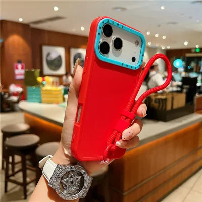 For iPhone 18 Pro Max / 17 Pro Max Case Contrasting Colors Shockproof TPU Phone Cover with Wrist Strap - Red